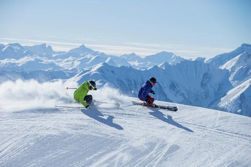 5d1dc23dc3fablaax 2 skiers scenic credit gaudenzdanuser winter 1516