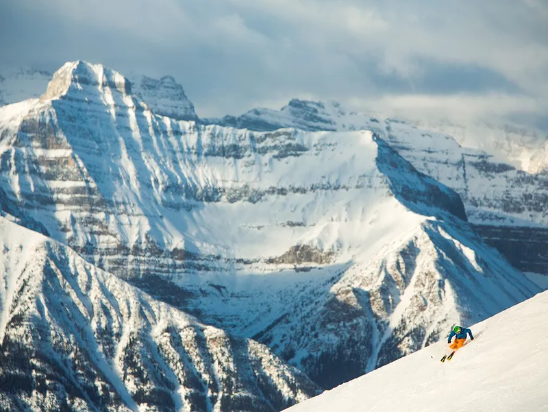 Lake Louise skier scenic © Banff Lake Louise Tourism Paul Zizka Photography