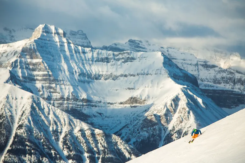 Lake Louise skier scenic © Banff Lake Louise Tourism Paul Zizka Photography