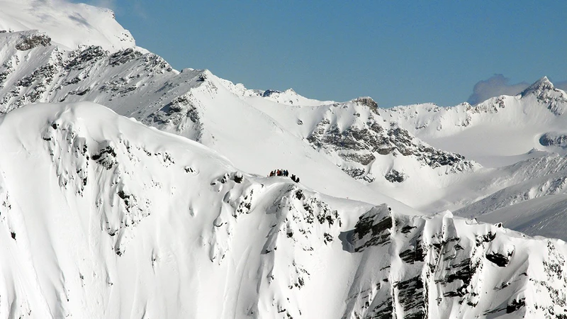 5d25ef2fed176skiers on top rk heliski canada