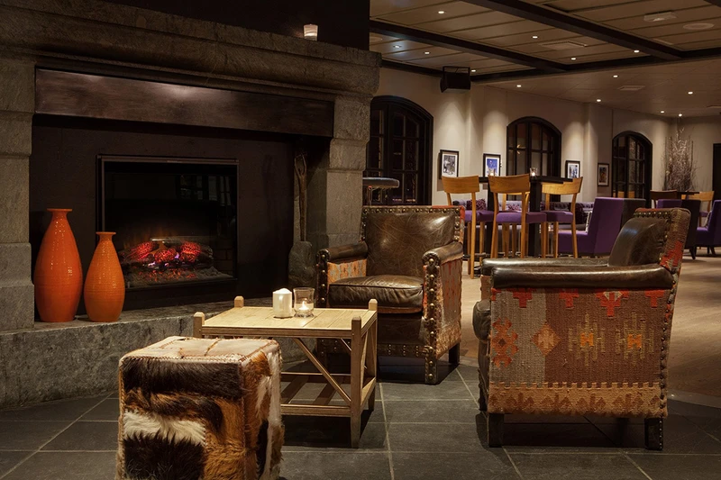 5d3ee145d56f3scandic hafjell lobby fireplace min