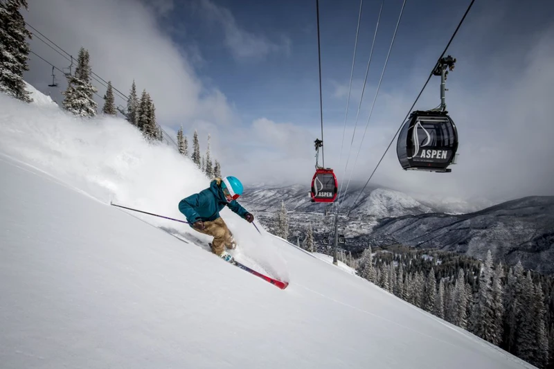 5d5d4c05e2b05aspen mountain skiing powder bluebird faceshot girl trees view sunny gondola credit matt power