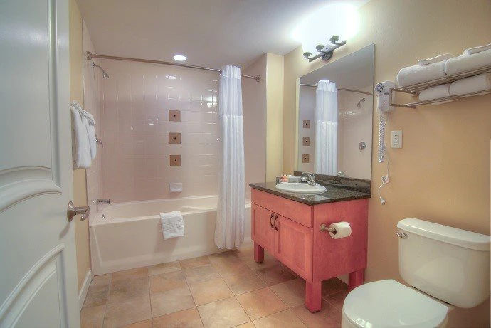 5e7ded994586dfraser crossing one bedroom condo kitchen gold bathroom