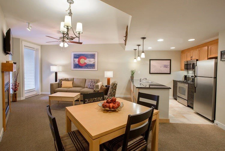 5e7ded9b51e29fraser crossing one bedroom condo kitchen gold living room