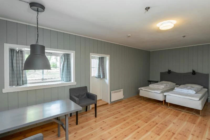 6001656bdd17d Nermo Hotel Studio Apartment Twin Bed and Dining Area