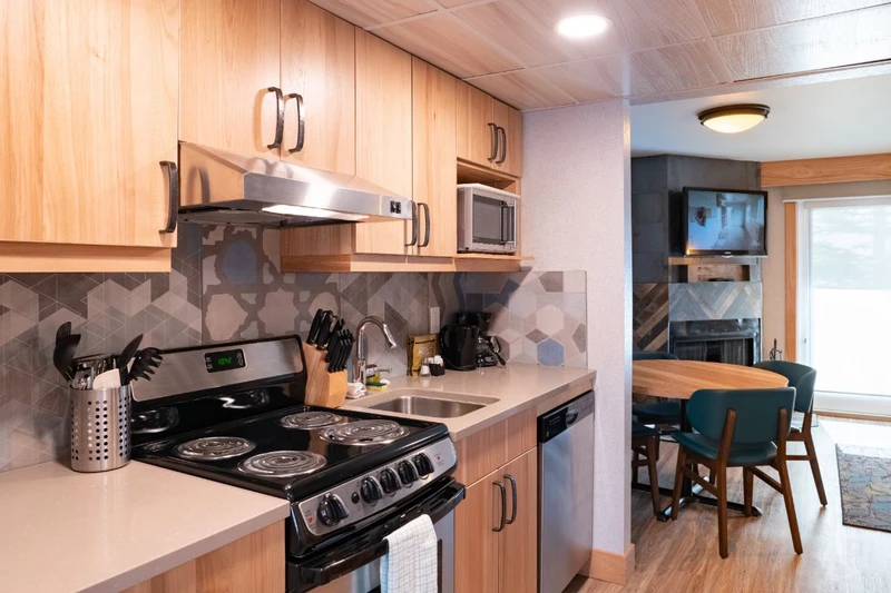62860b12c2c64 Tunnel Mountain Resort Studio Condo Kitchen and Dining Area