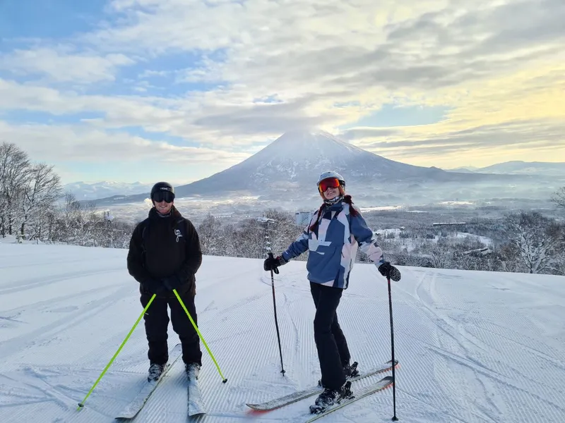 Jack and Scarlett in Niseko with Mount Yōtei in the background