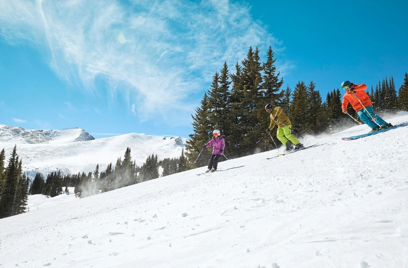 Bluebird Family Skiing in Breckenridge © Andrew Maguire