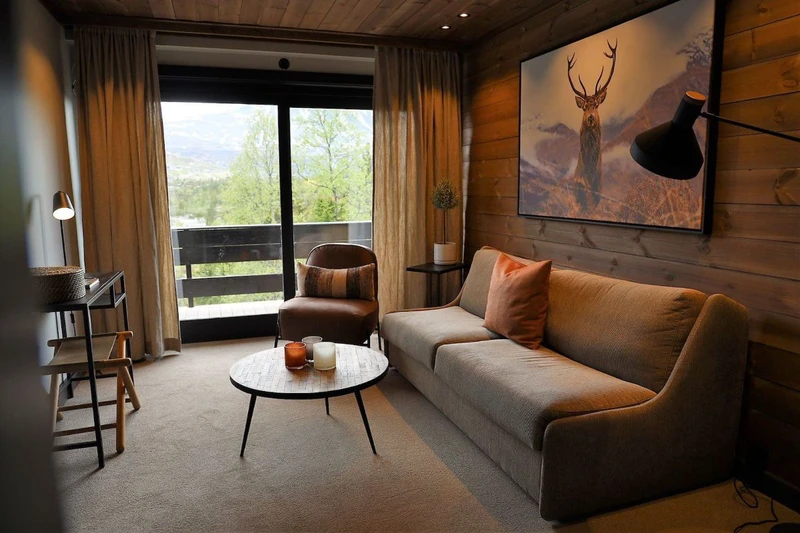 64be6cf7a752e Gaustablikk Fjellresort Suite Living Area with Balcony