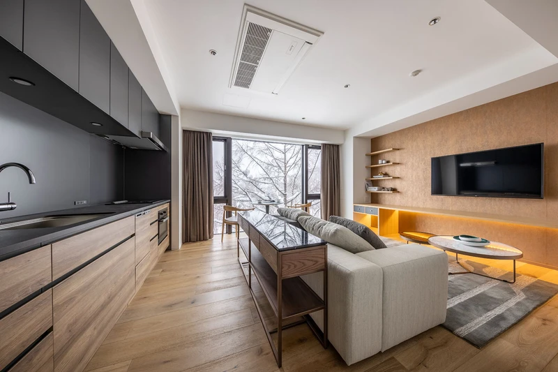 65521fa606d09 Intuition Niseko 2 Bedroom Deluxe Aparment Kitchen Living Area