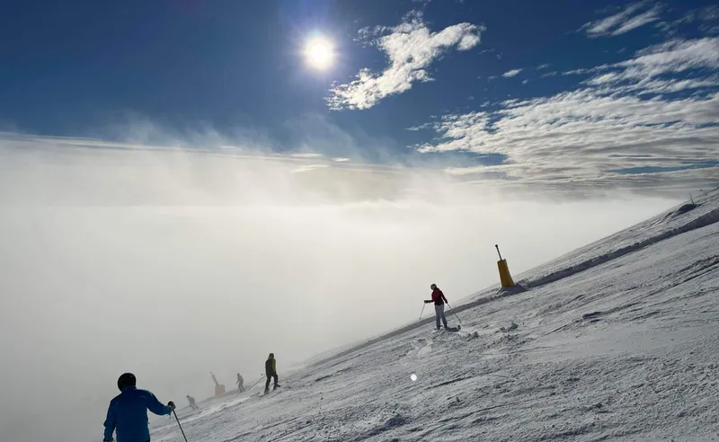 Skiers above the clouds, Trysil, Norway - Trudy Wilkes Thompson - February 2023