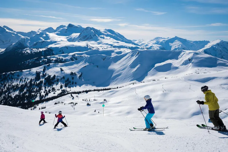 Family Bluebird Skiing in Whistler © Tourism Whistler/Mike Crane