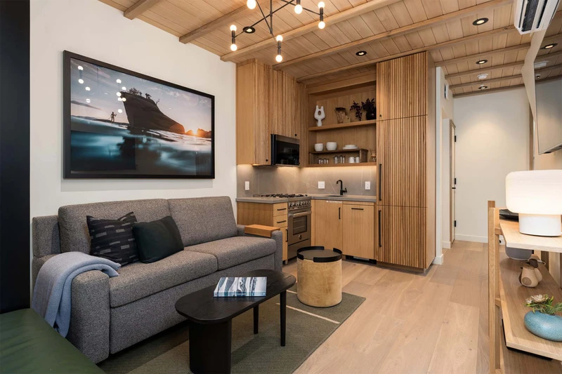 664f4777eed10 Townhome Livingroom and Kitchen Desolation Hotel