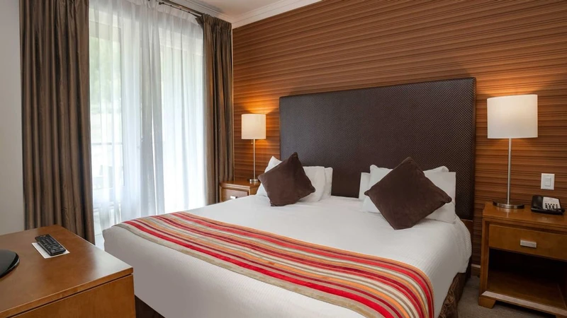 66c752ddc0fc0 Sutton Place Hotel One Bedroom Suite Bedroom