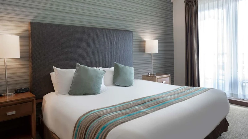 66c75450ccfa2 Sutton Place Hotel Two Bedroom Suite Bedroom