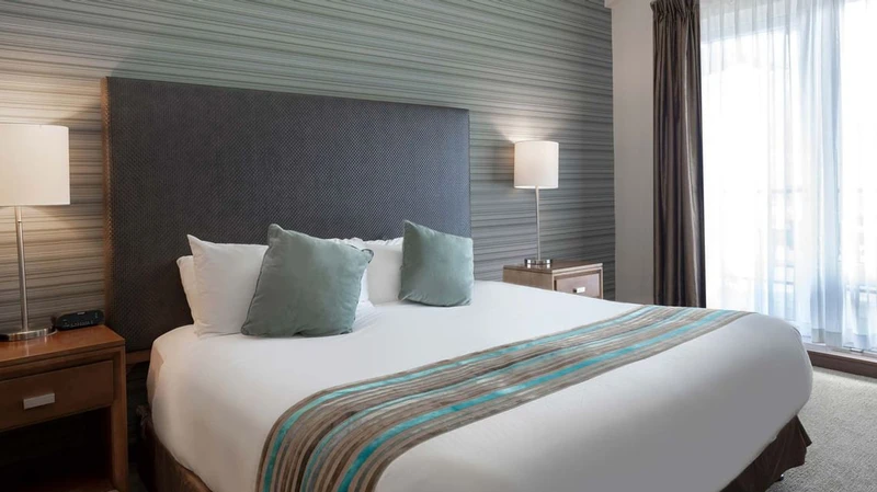 66c754a6b4755 Sutton Place Hotel Three Bedroom Suite Bedroom 1