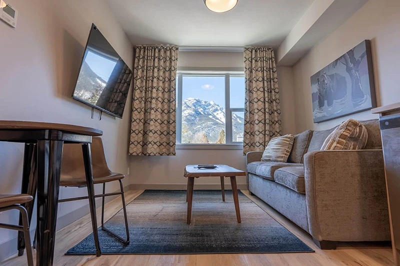 67f539761191c Basecamp Banff Suites One Bedroom Apartment Living Room