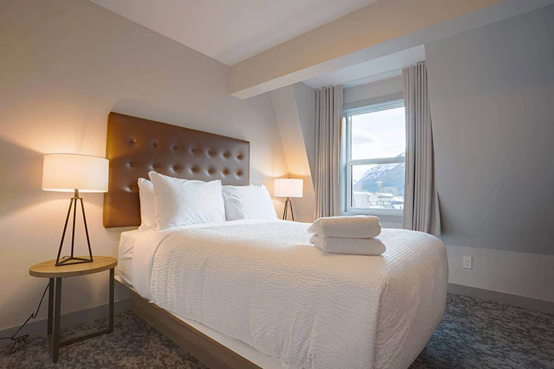 67f54cf06378e Basecamp Banff Suites Superior Three Bedroom Apartment Bedroom 3