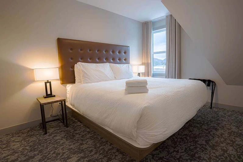 67f54e5e509d2 Basecamp Banff Suites Superior King Two Bedroom Apartment Bedroom 1