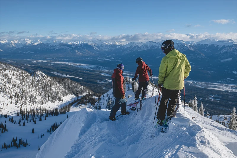 Three Skiers About to Drop in in Kicking Horse © Destination BC / Reuben Krabbe