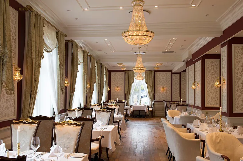 Fleischer's Hotel Restaurant with crystal chandeliers, panelled walls and drapes