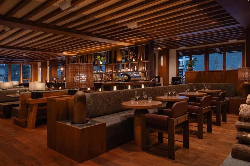 Ambiently lit Good Folk Restaurant with rows of empty tables