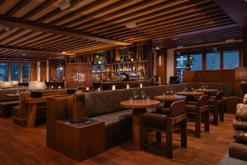 Ambiently lit Good Folk Restaurant with rows of empty tables
