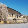 Street view of Fleischer's Hotel on a snowy, sunny day