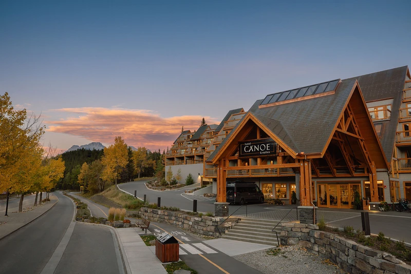 Street view of Hotel Canoe and Suites at sunset