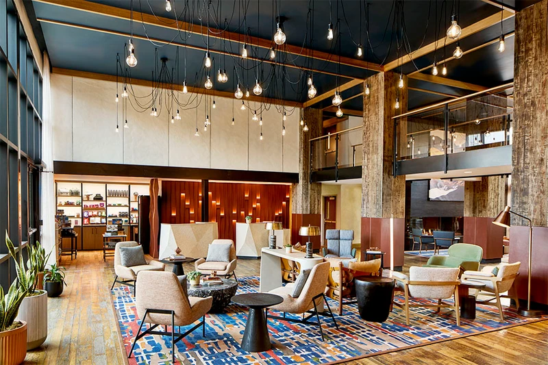 Lobby lounge area at Hotel Thaynes with comfy chairs and rugs