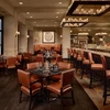 Tables and benches at the bar of the Brass Bear at Park Hyatt Resort & Spa