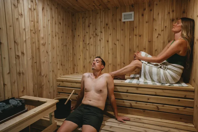 A couple enjoying the sauna at the Kendrick Hotel