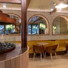 Tables ready for diners at the Sudden Sally Restaurant at Hotel Canoe and Suites
