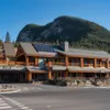 Front of the Otter Hotel in summer, with pine mountain behind