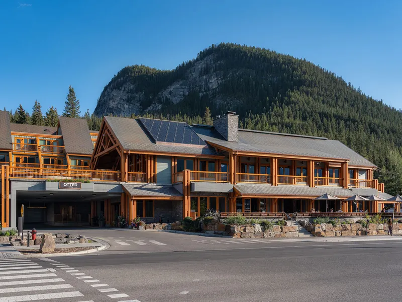 Front of the Otter Hotel in summer, with pine mountain behind