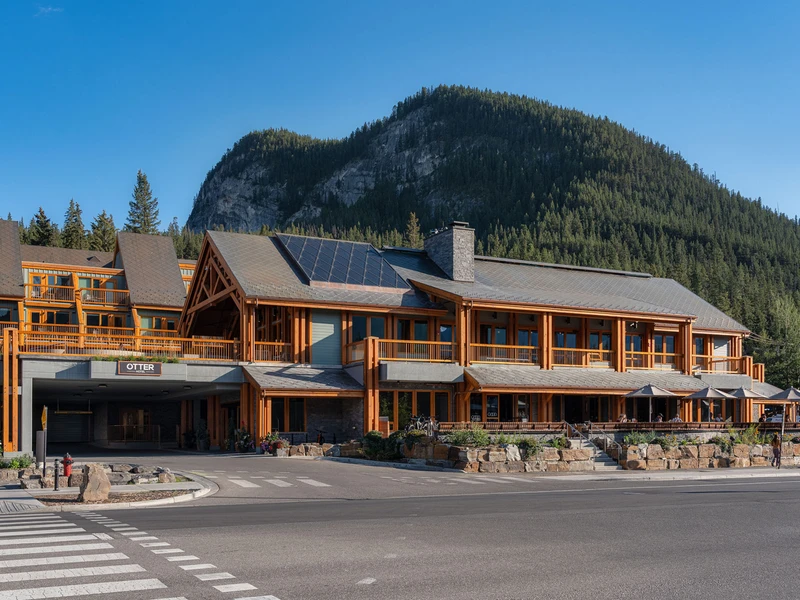 Front of the Otter Hotel in summer, with pine mountain behind