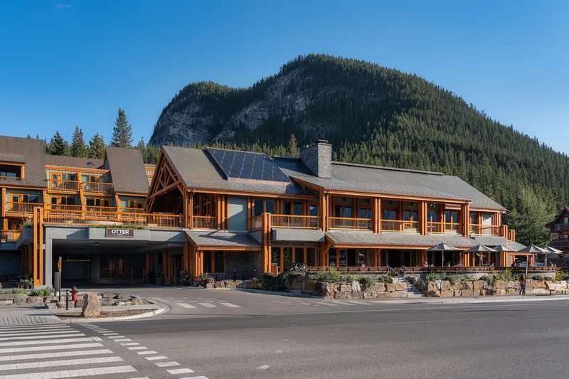 Front of the Otter Hotel in summer, with pine mountain behind